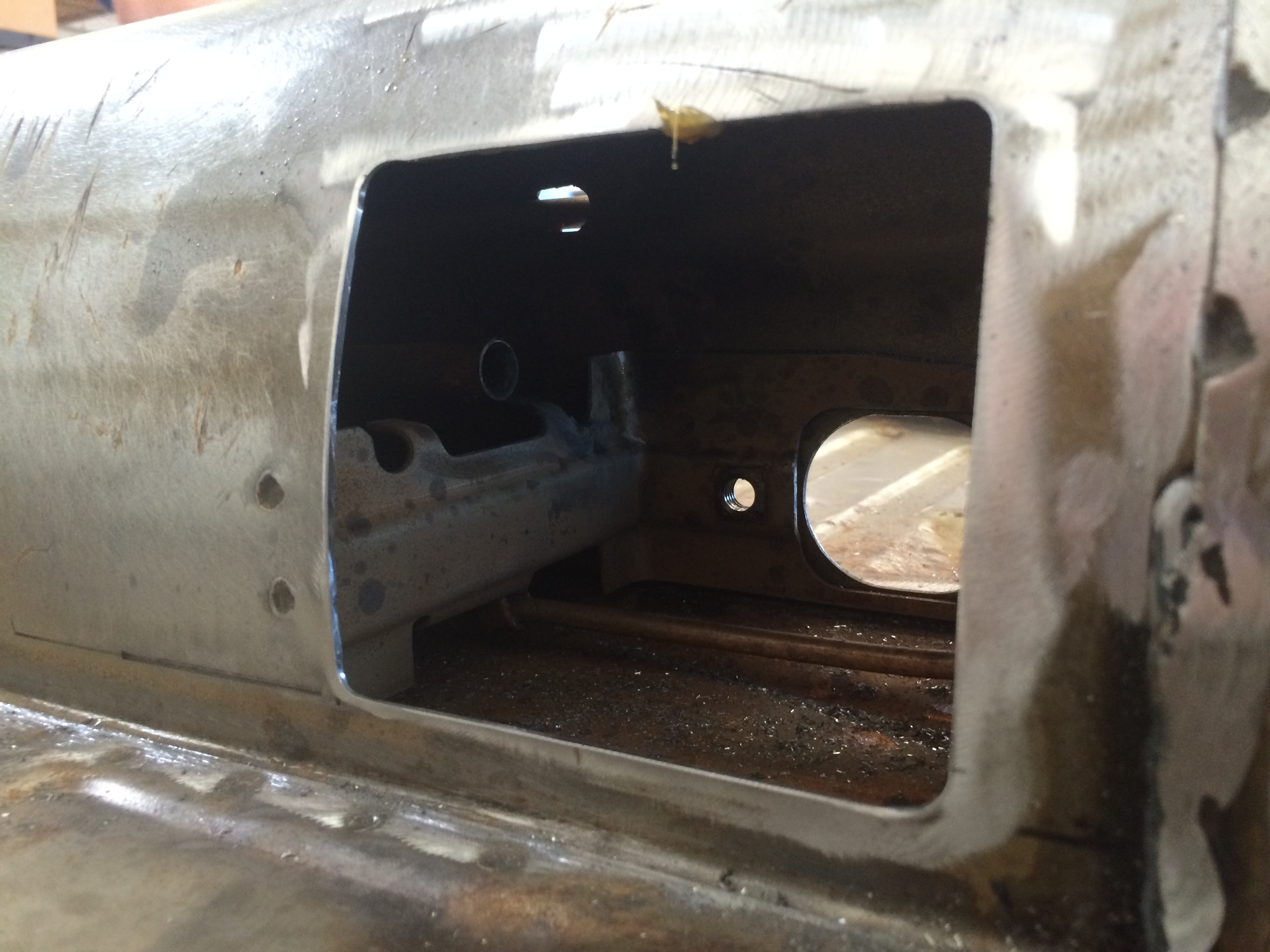 Tack-welding the clutch tube to its bracket through the new access port
