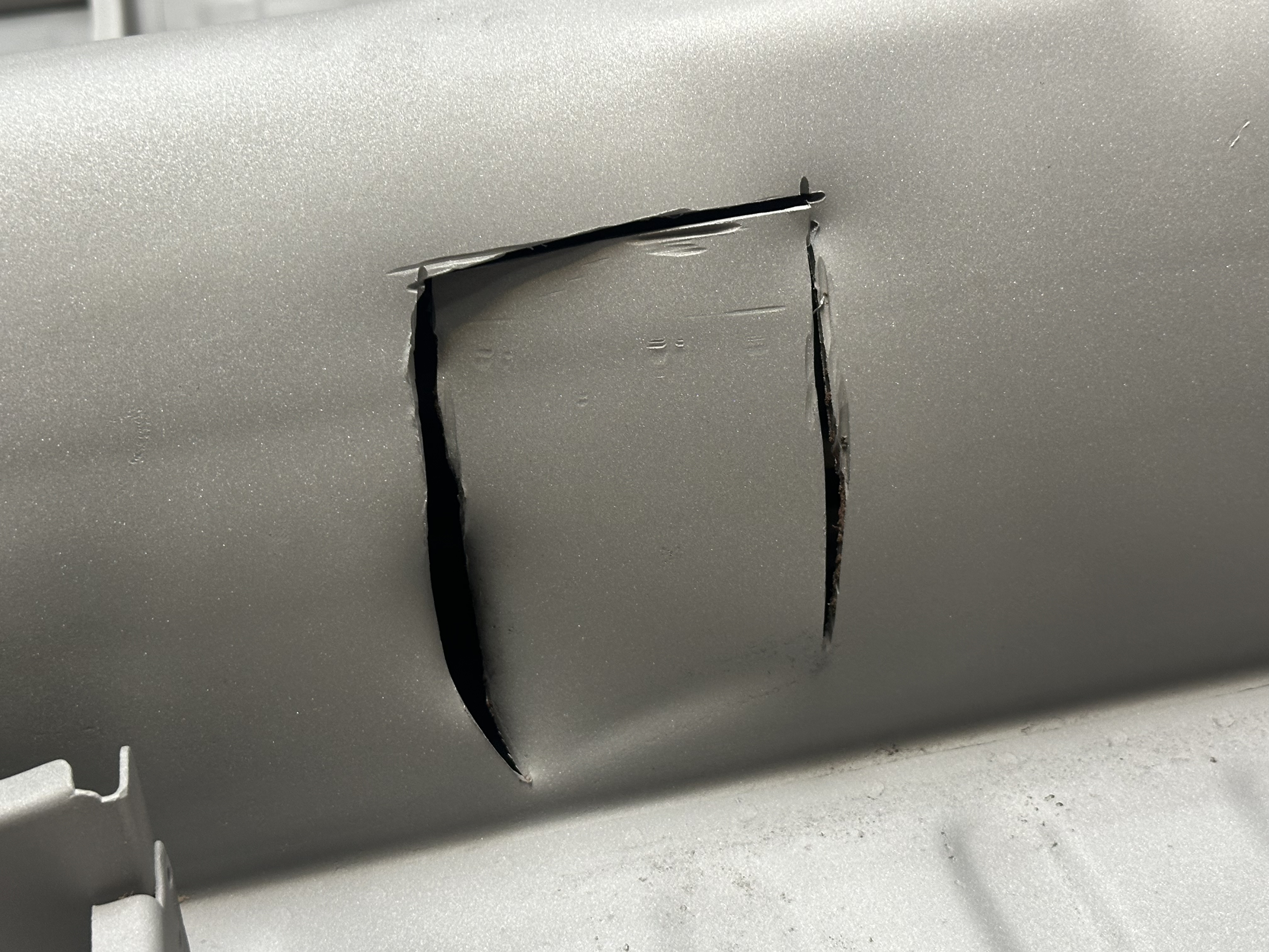 Air chisel damage to the chassis tunnel from a previous repair