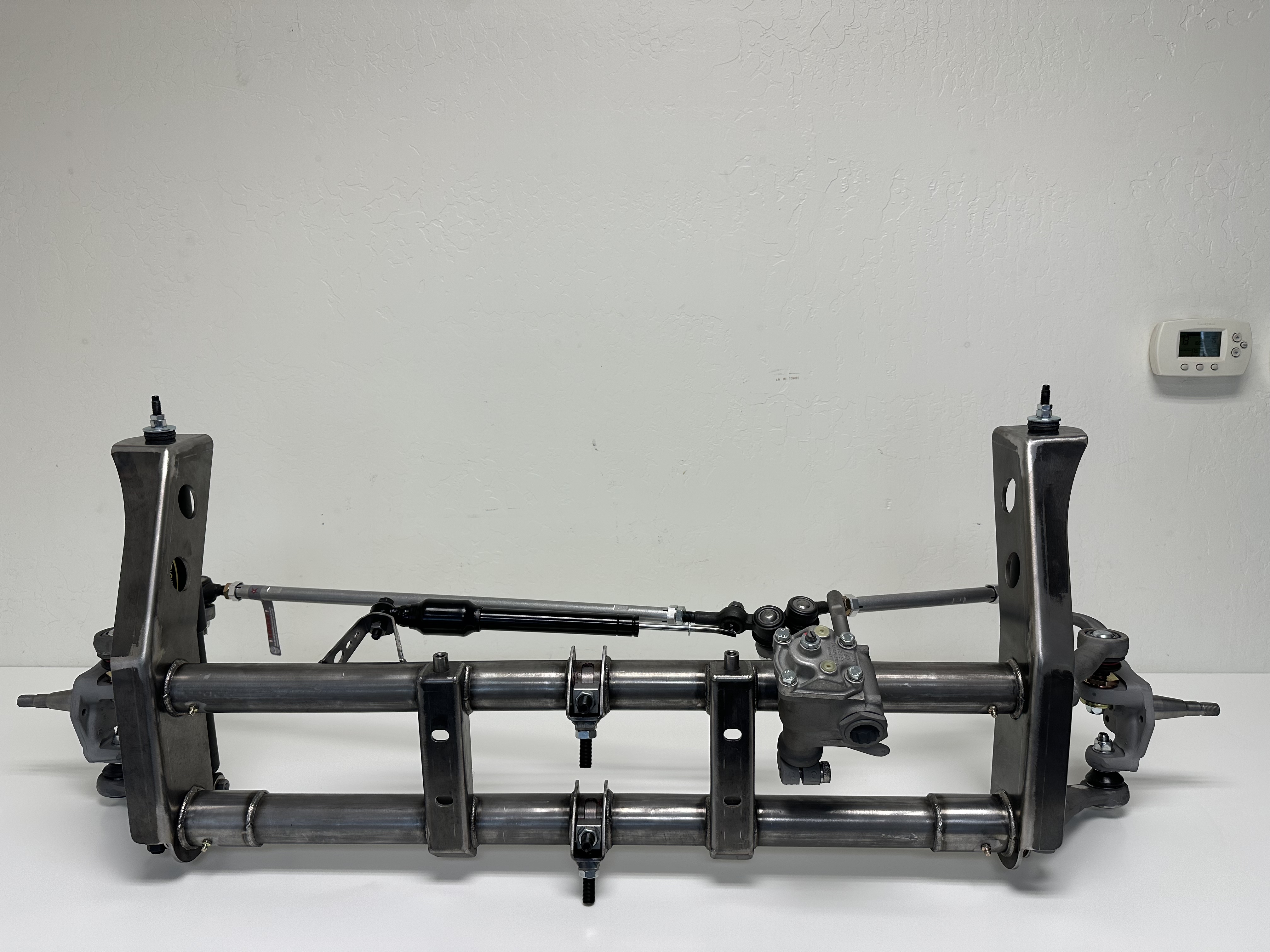 Airkewld ECObuilt Assembled Front Axle Beam in raw steel with complete steering