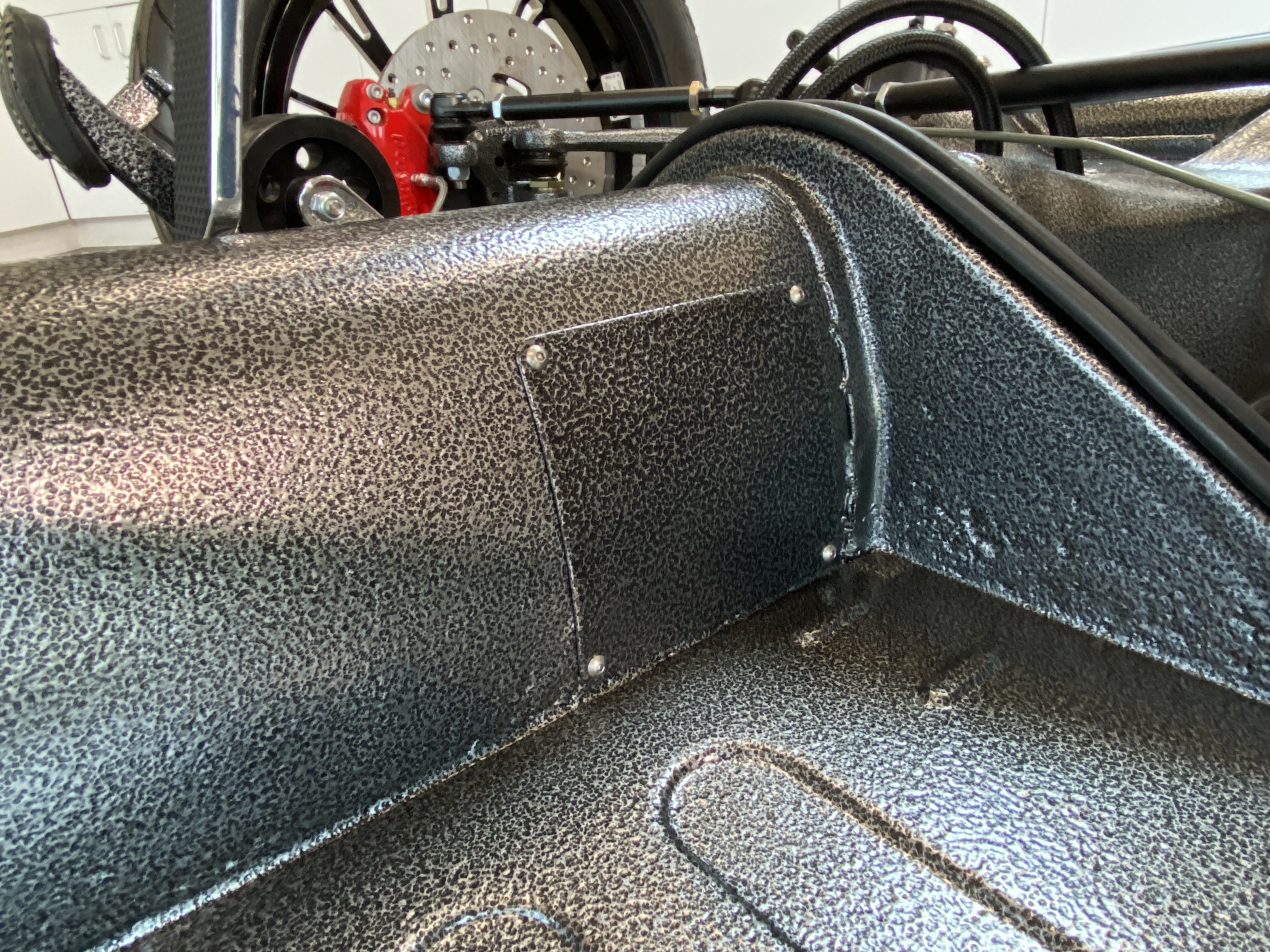 Close-up of the Chassis Inspection Plate sealed against the VW tunnel