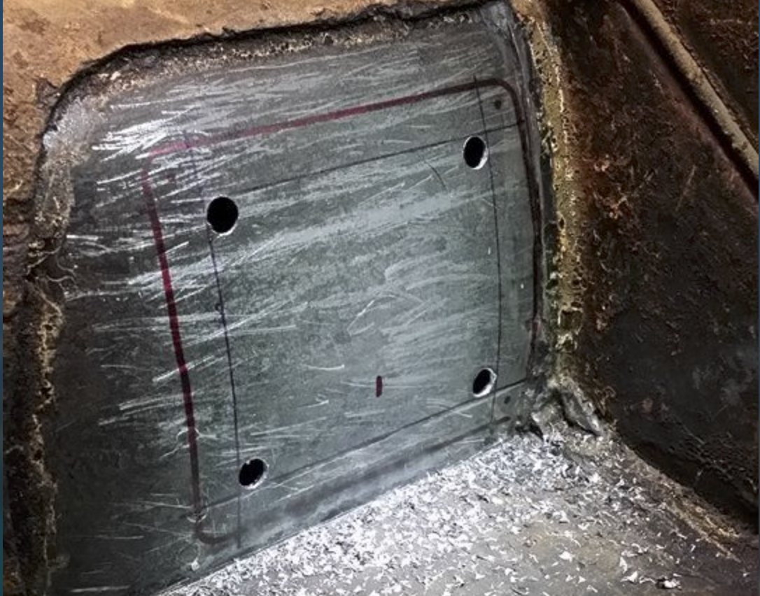 Center-punching and step-drilling the cutout corners