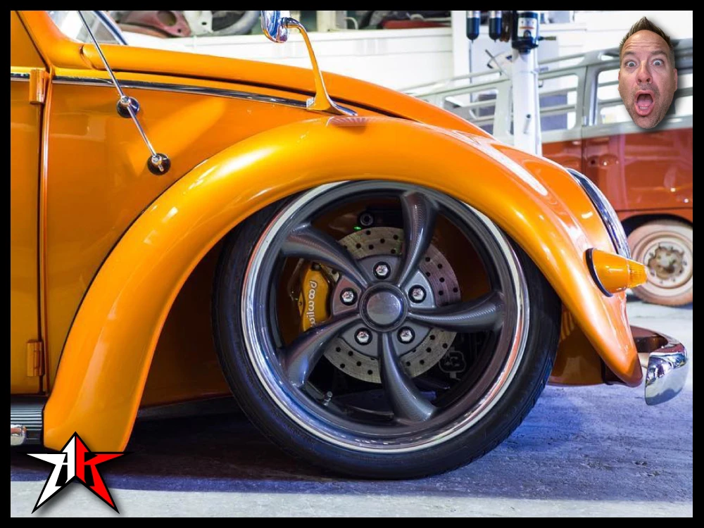VW Beetle on air ride aired out with wheel tucked cleanly in fender