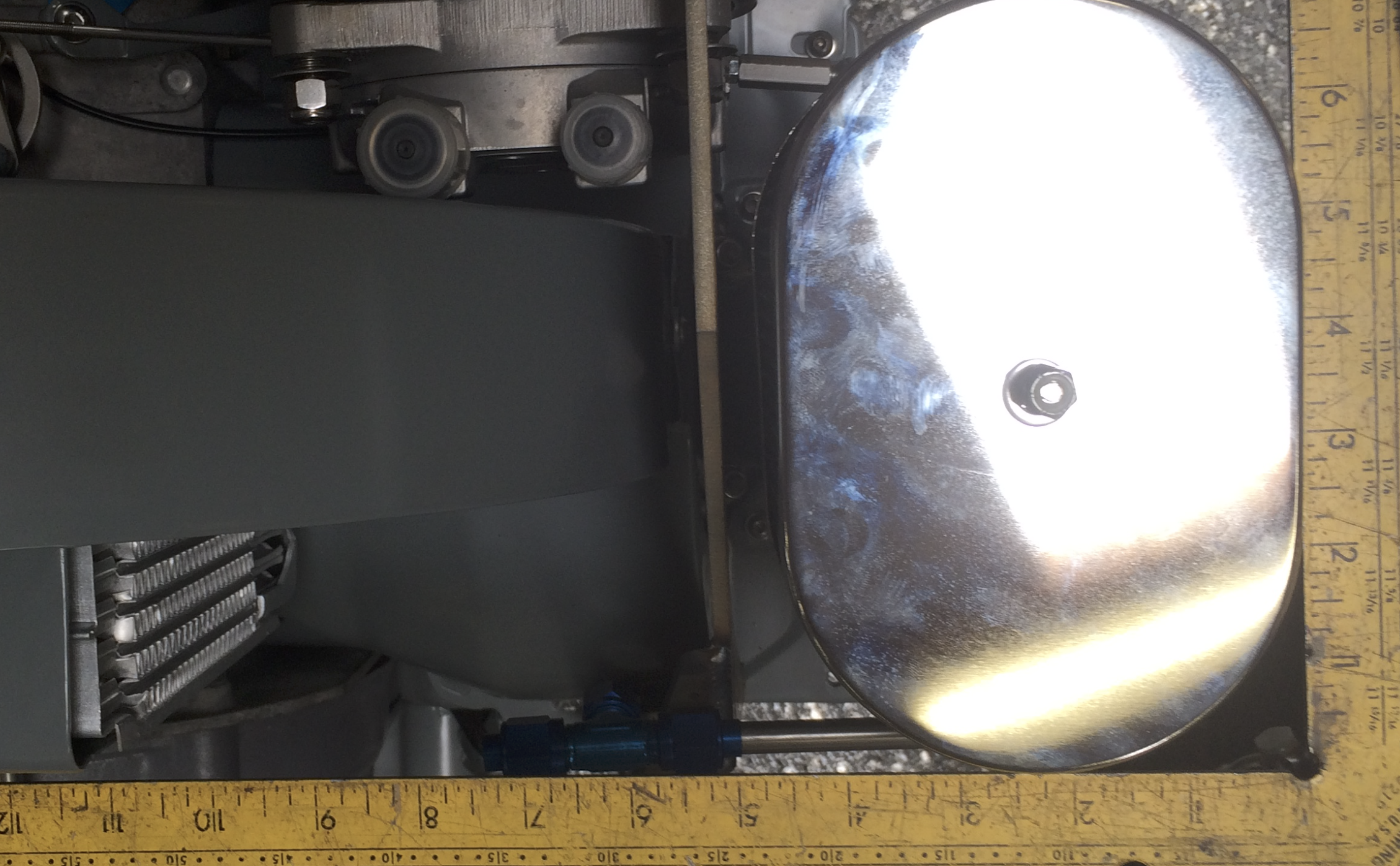 Bulkhead fitting installed in the front tin with vertical drop tube going straight up