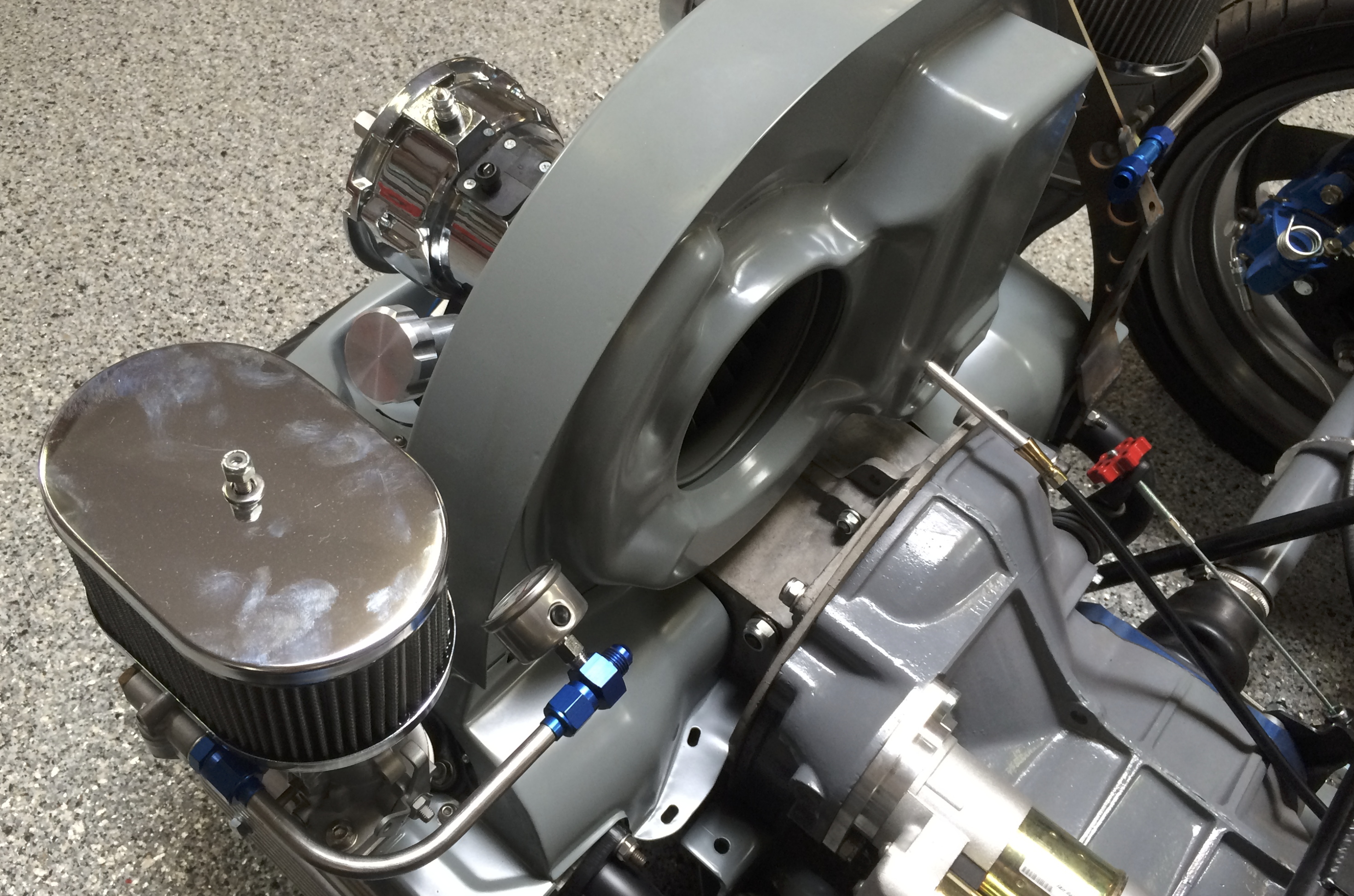 Installing the AN tee, gauge adapter, and cross line across the back of the fan shroud