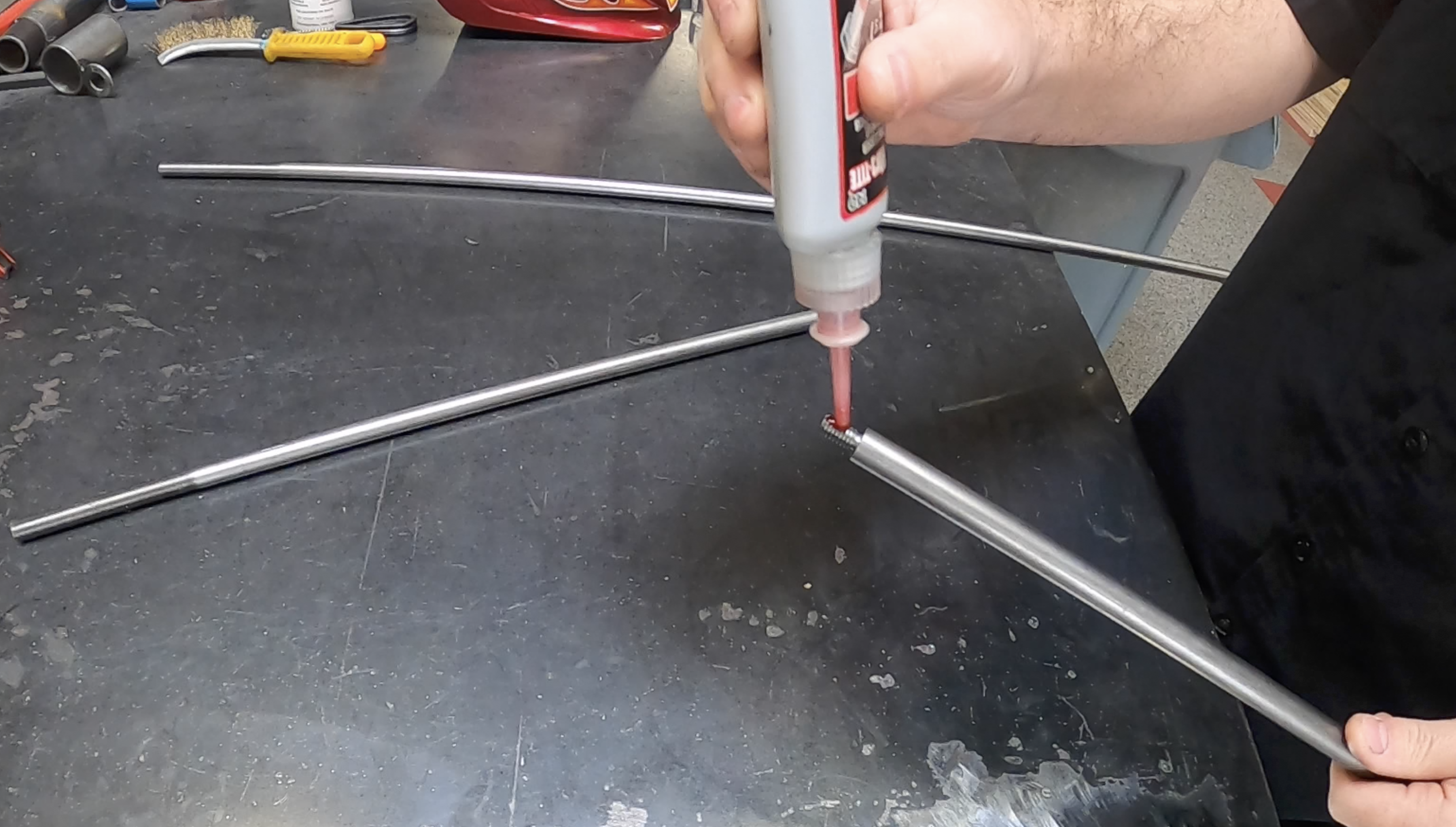 Through rods threaded together with Loctite, ready to slide into the beam