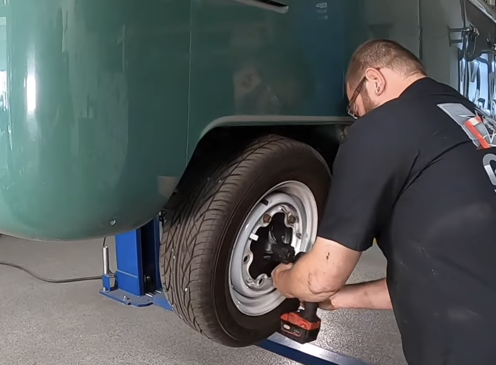 Loosening the left rear lug nuts before jacking the VW