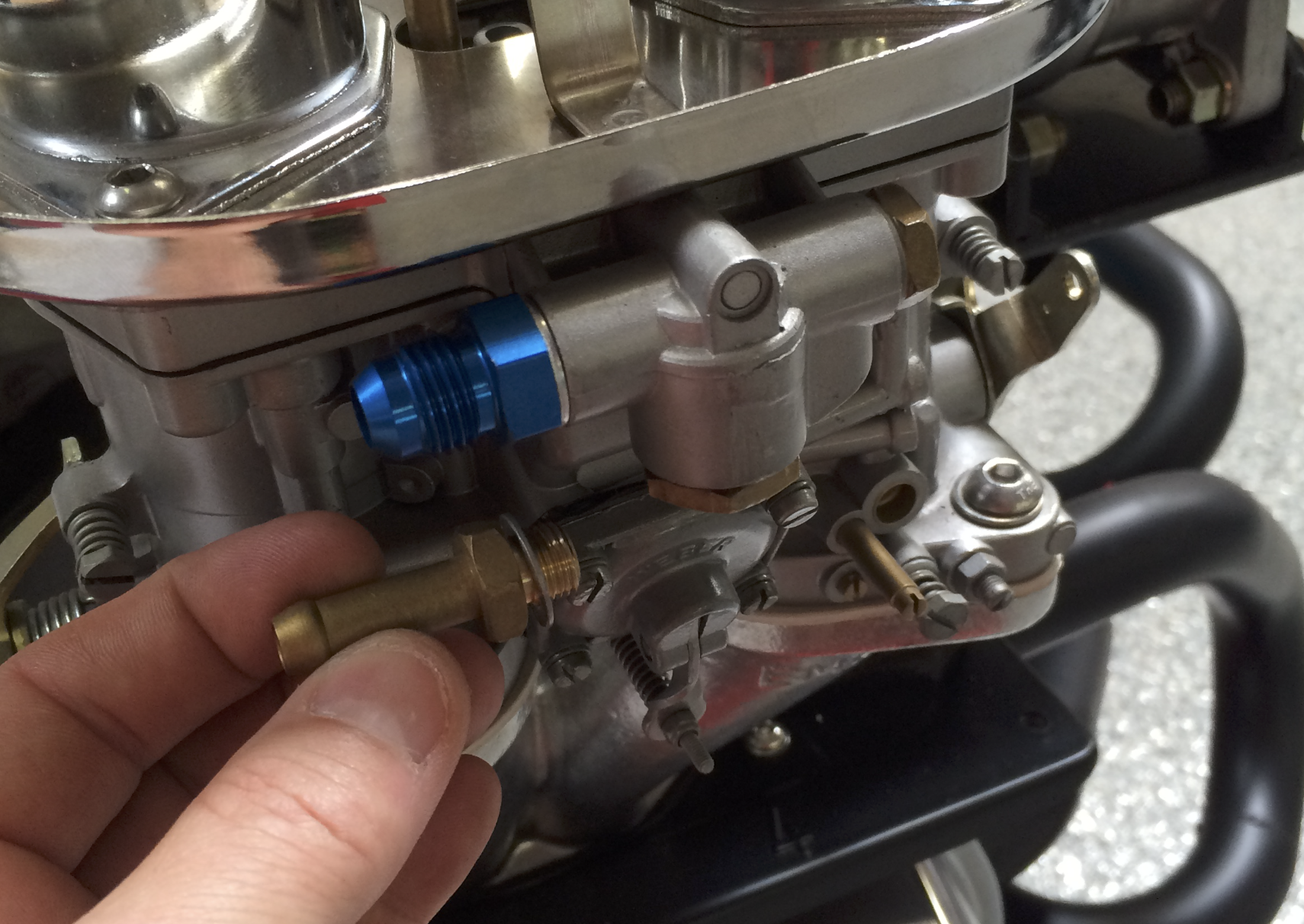 Threading new AN fittings into the carb fuel inlets, dry threads no sealant