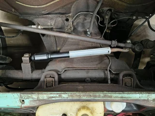 worn VW steering damper compared to new damper