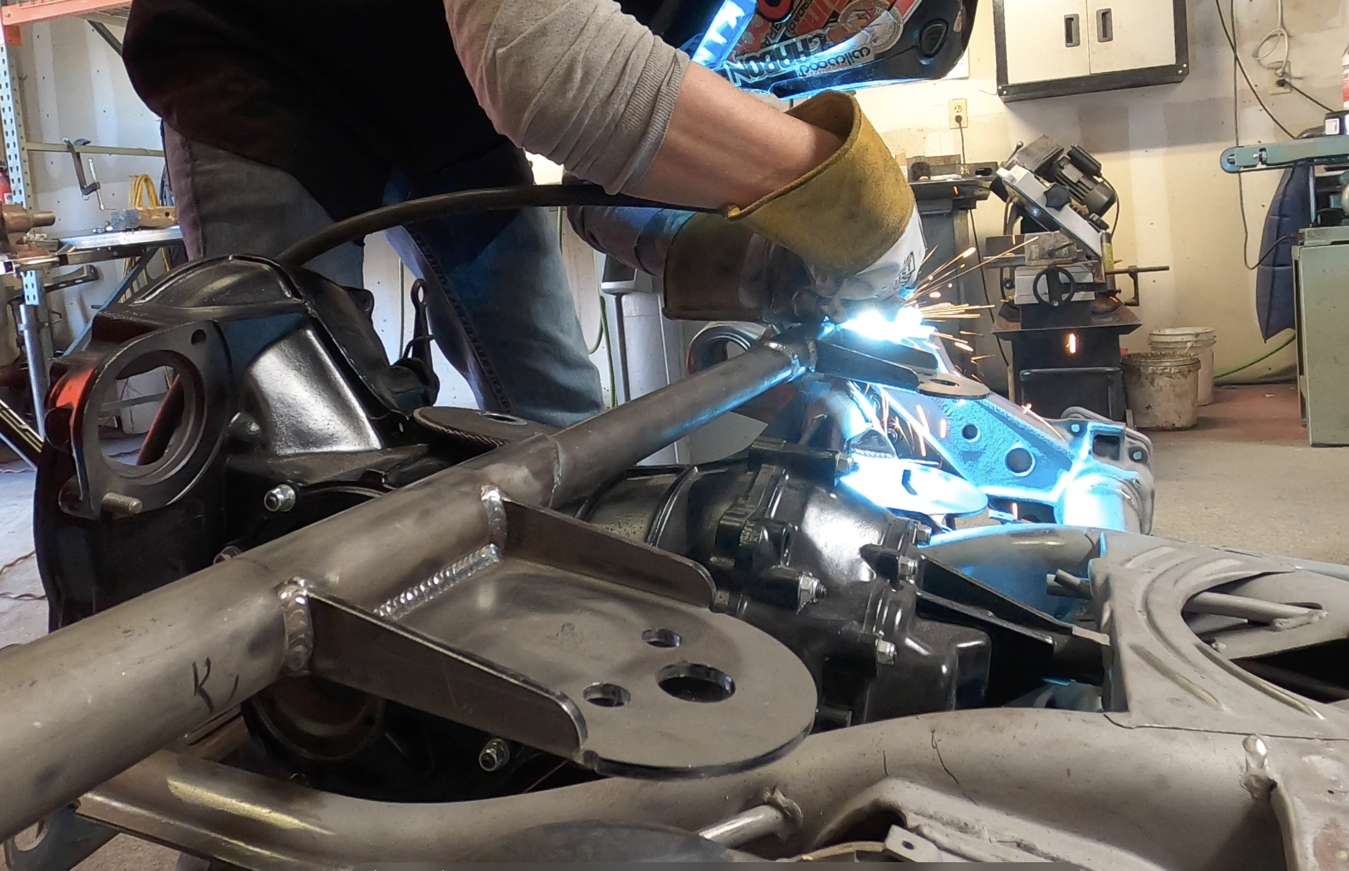 Telescoping upper bag mount tacked in and lower bag circle welded into the trailing arm